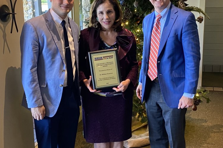 Mary Demetree (middle), daughter of William Demetree, 2021's Roger S. Swanson Lifetime Achievement Award winner, poses for a photo