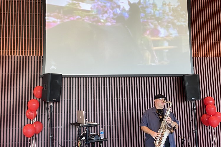 Saxophonist plays at John Craig's Kentucky Derby charity benefit